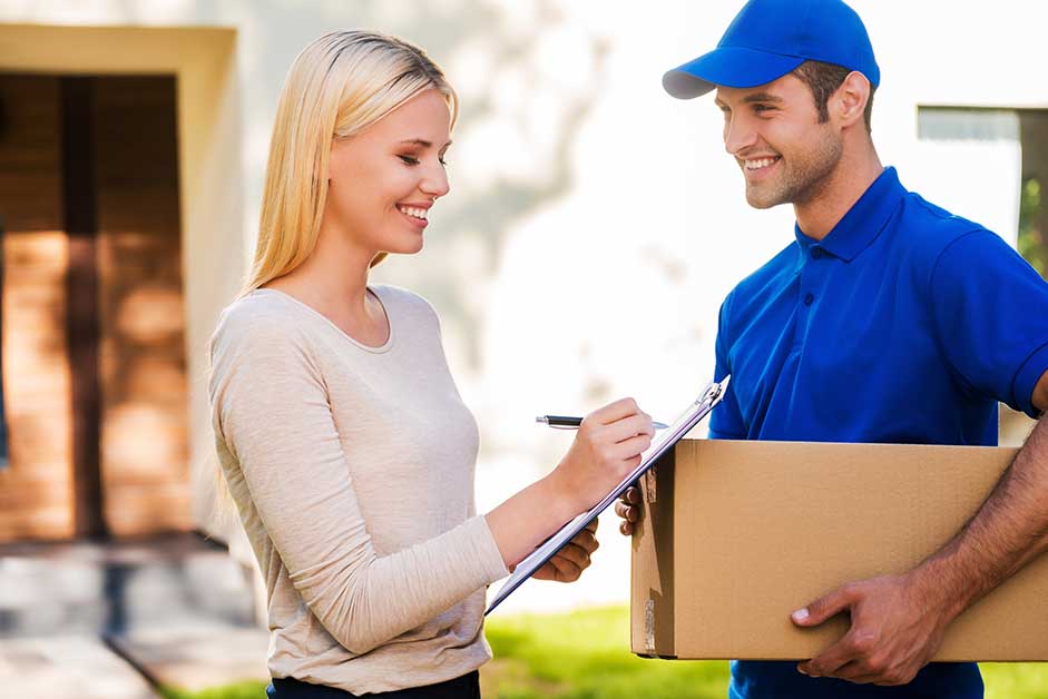 Woman accepting delivery from driver